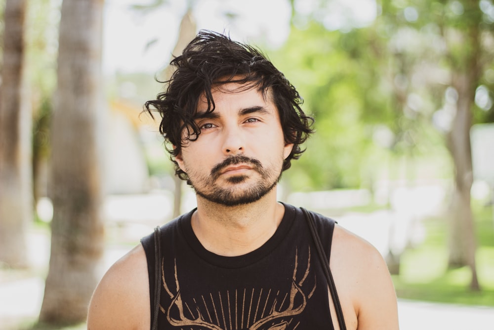 man in black tank top