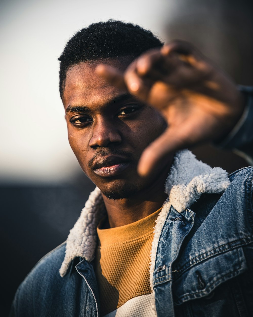 man in blue denim jacket