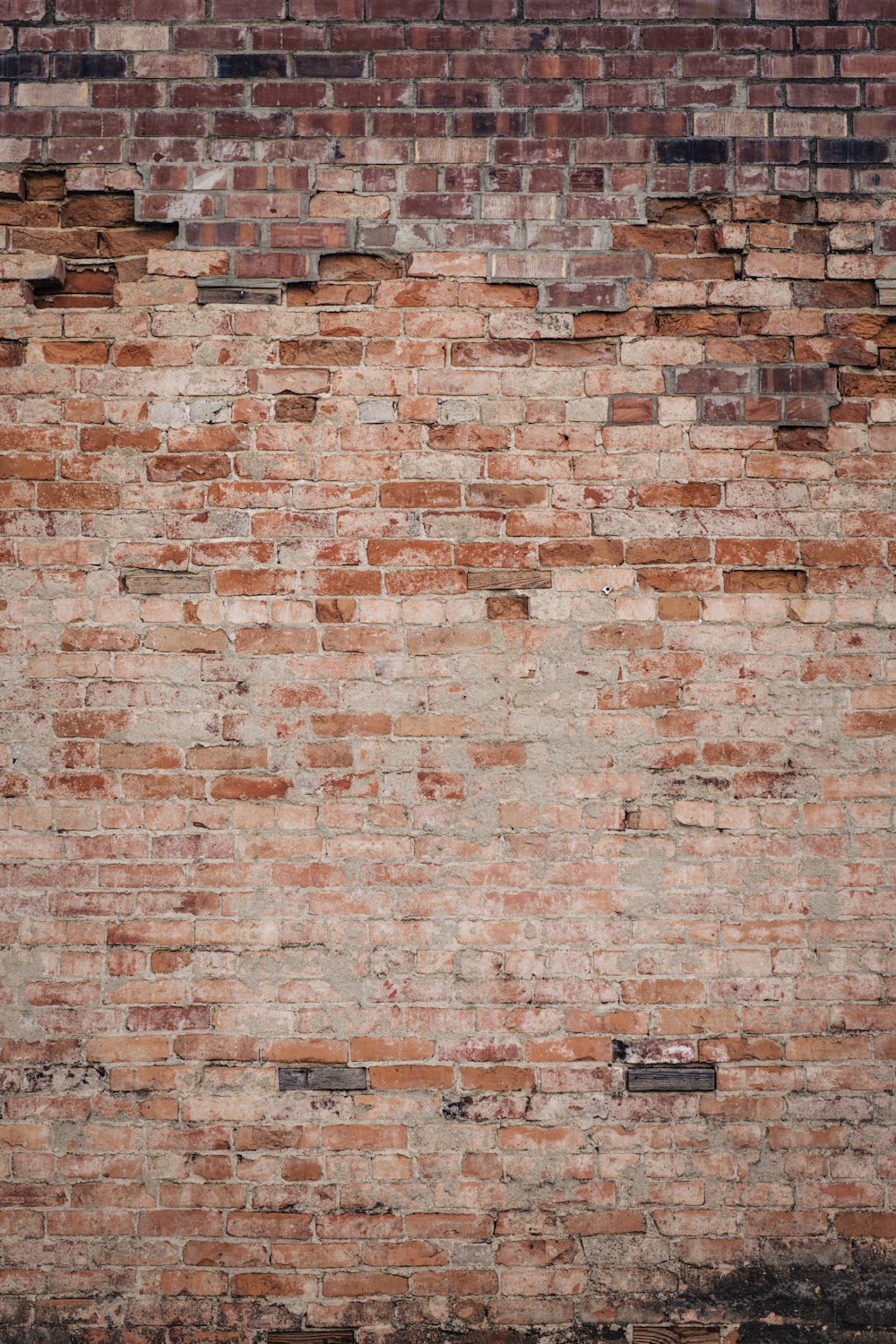 brown brick wall during daytime