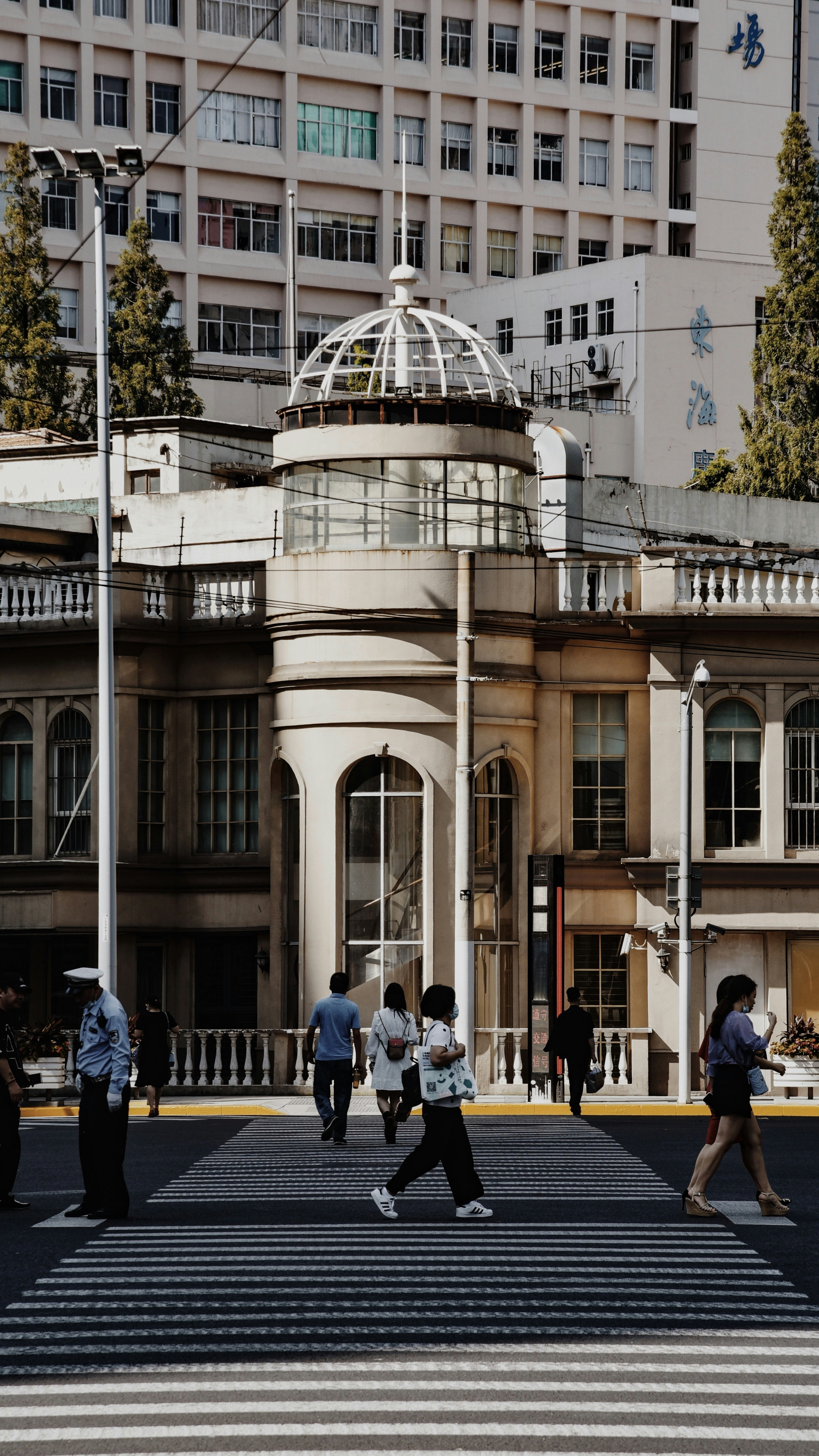 people walking on street near brown concrete building during daytime