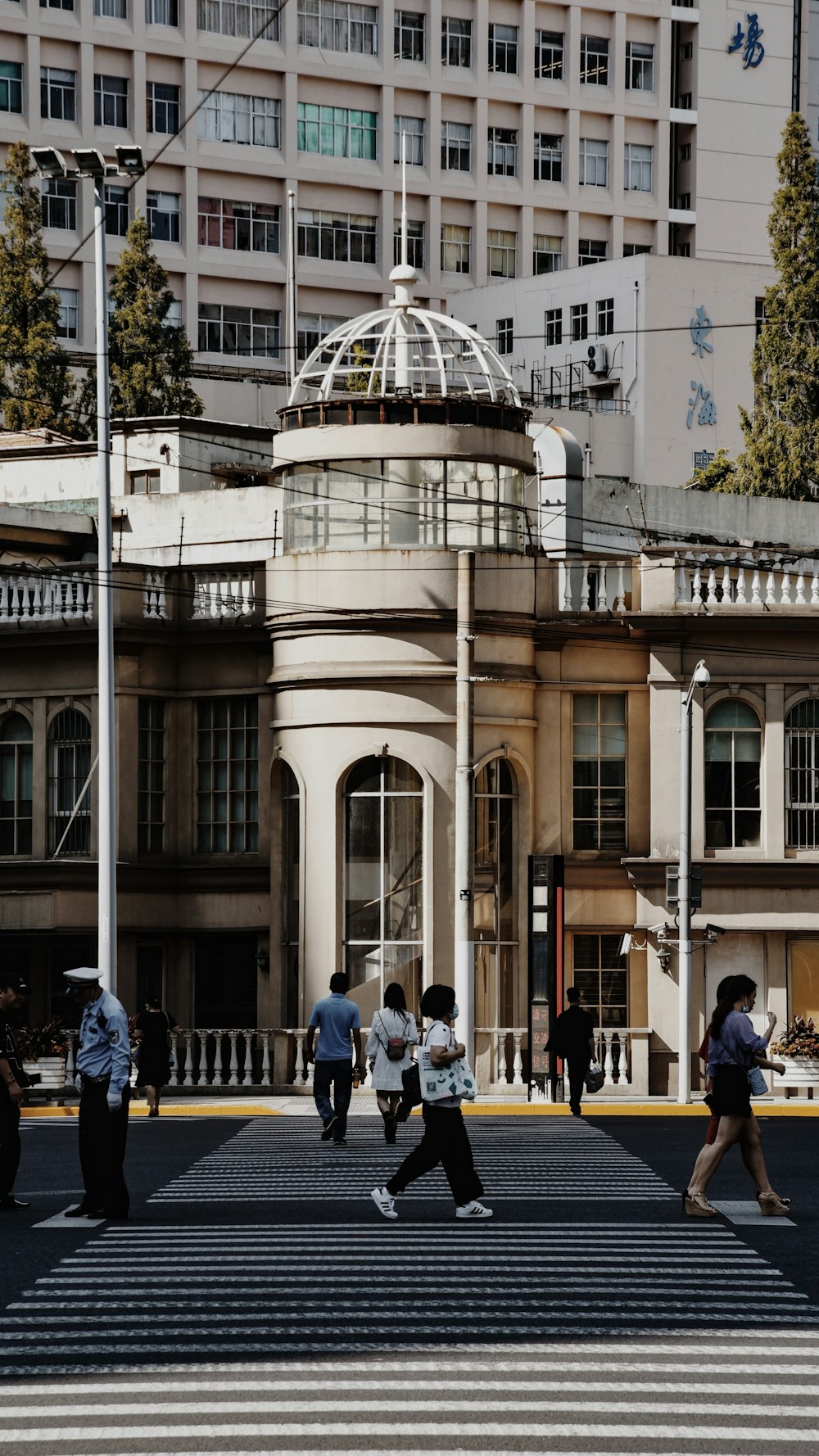 people walking on street near brown concrete building during daytime