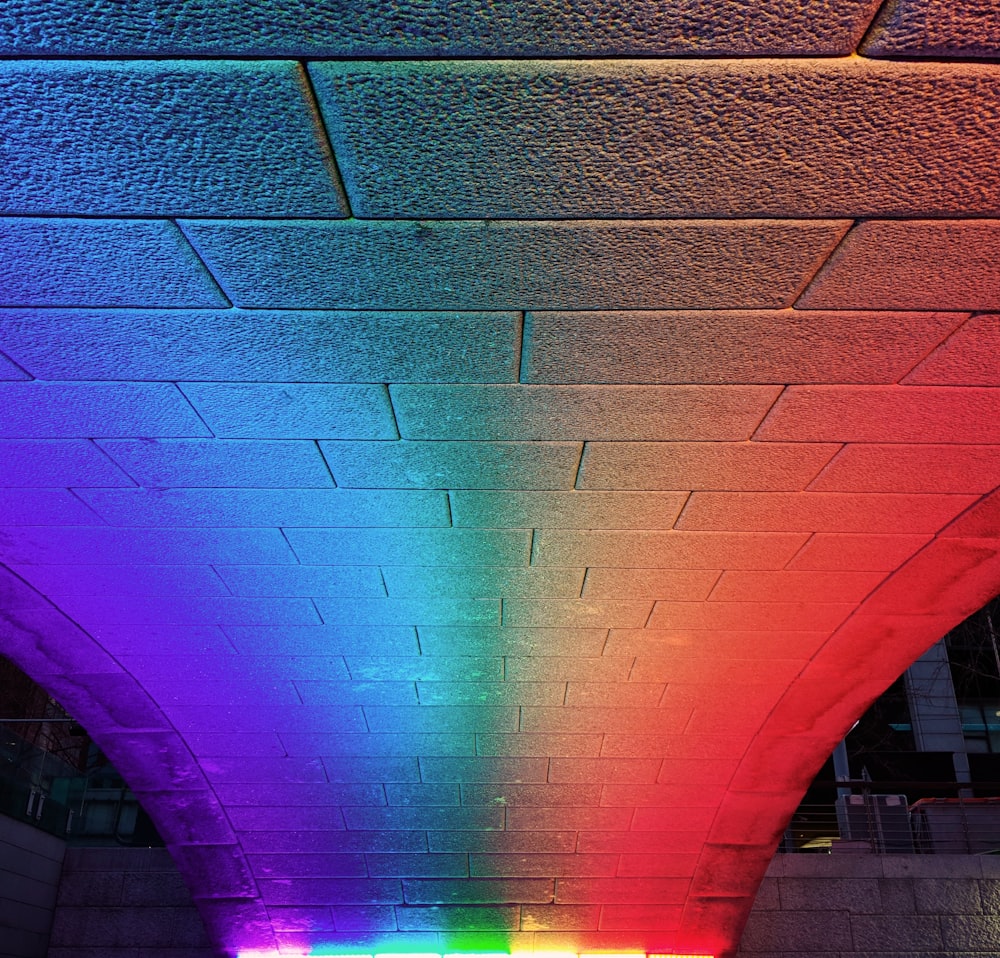 purple light on brown brick wall