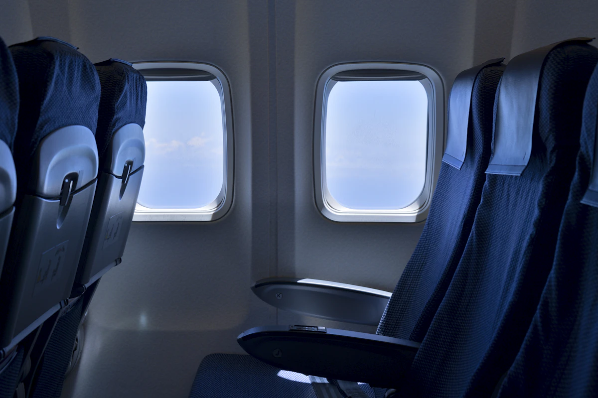 Black and white airplane seat in an aircraft cabin