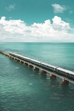 brown wooden dock on sea under blue sky during daytime