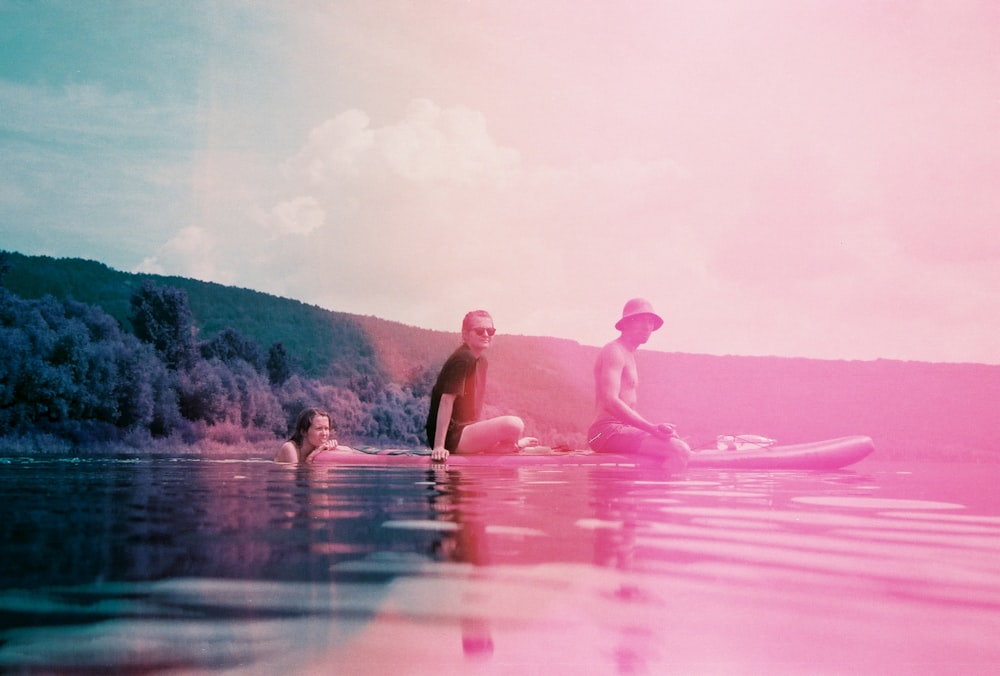 2 women in body of water during daytime