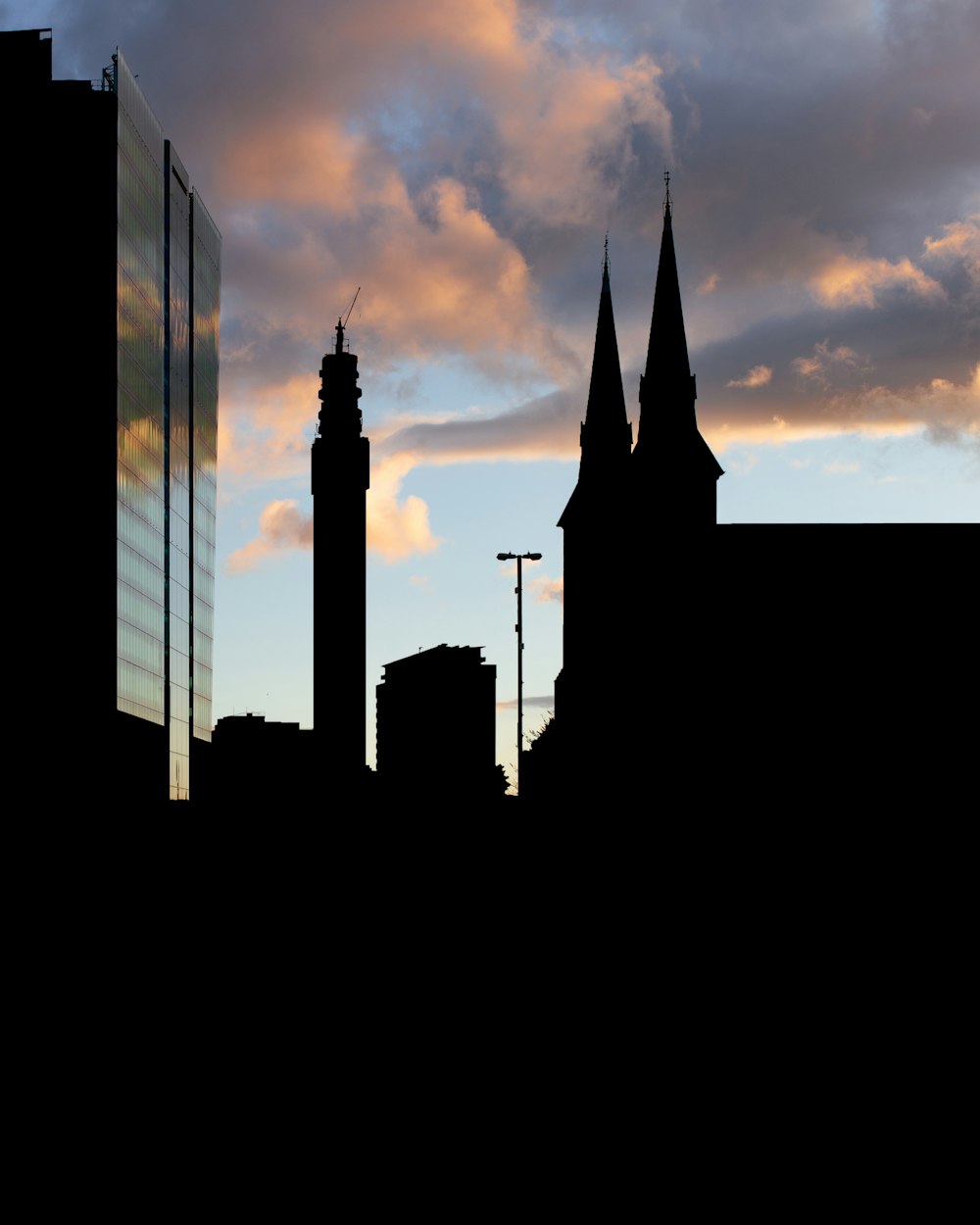 silhouette of building during sunset