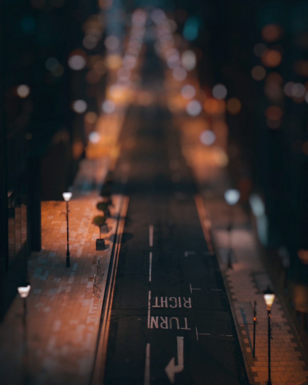 city street with yellow lights during night time