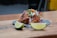 A vibrant plate of fish tacos garnished with fresh cilantro and lime wedges on a rustic wooden table.