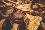 A close-up of hand-turned wooden bowls with smooth, natural finishes.