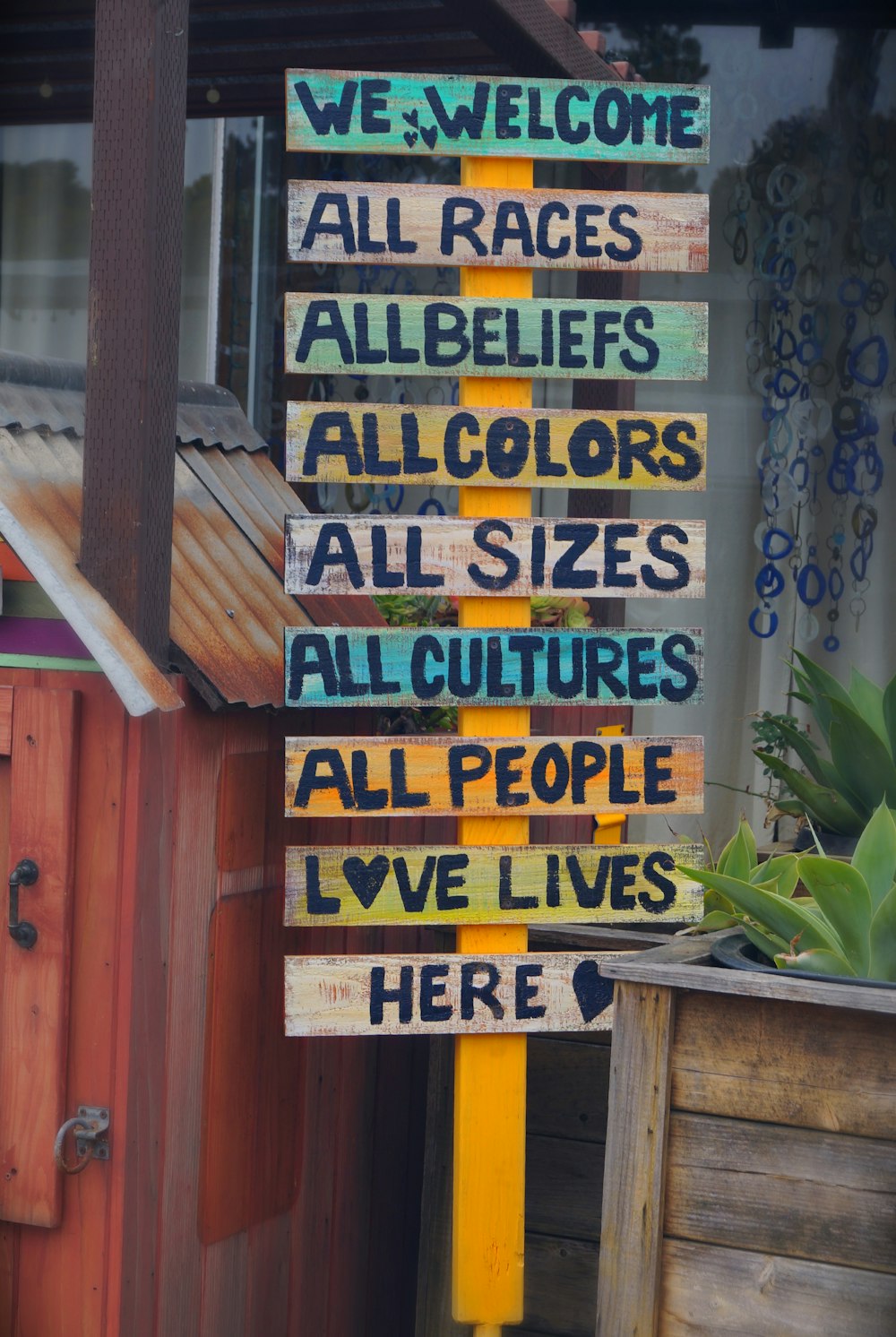 blue and yellow wooden signage