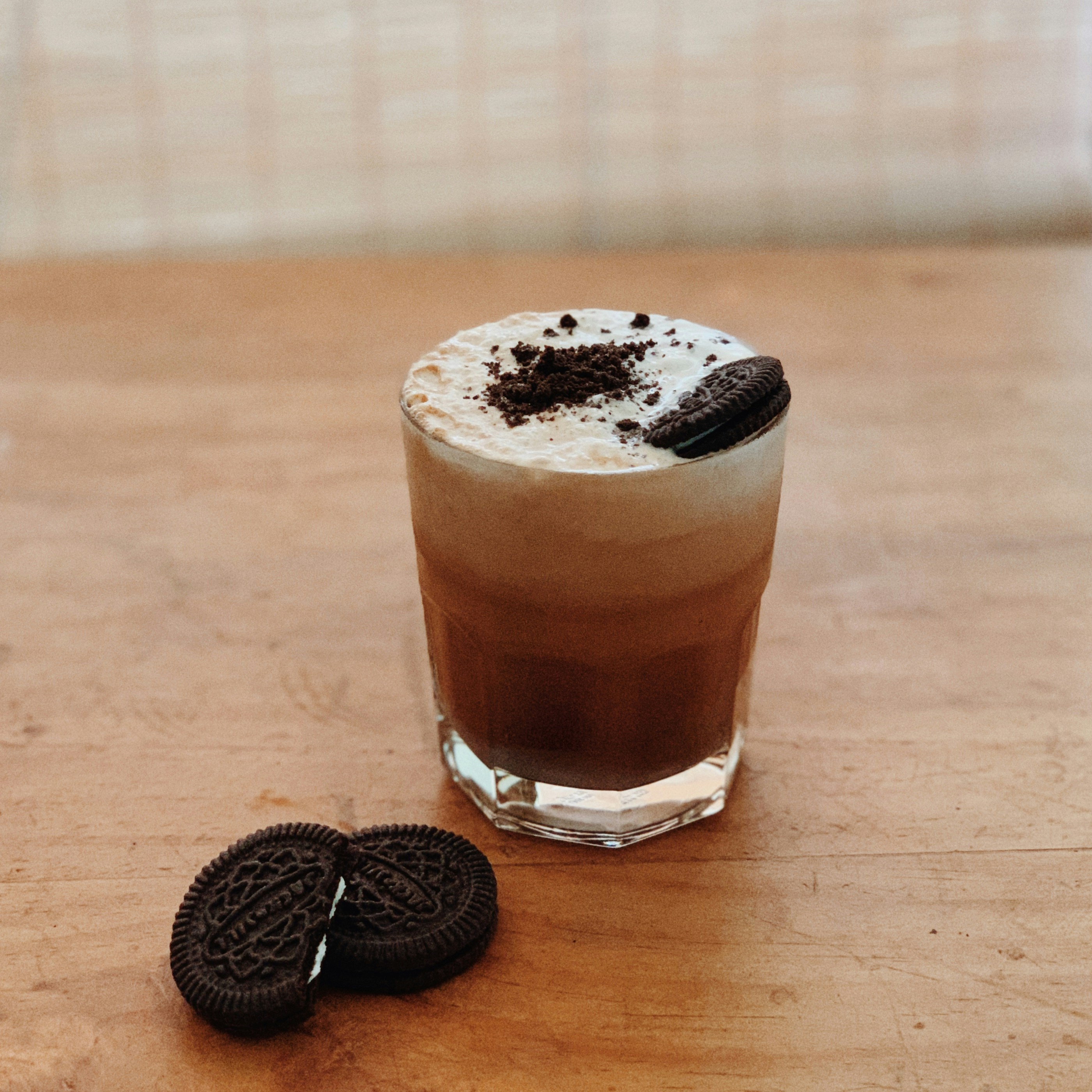 Dubai Chocolate Milk Tea with dark chocolate cream cheese foam and Oreo cookie crumble topping