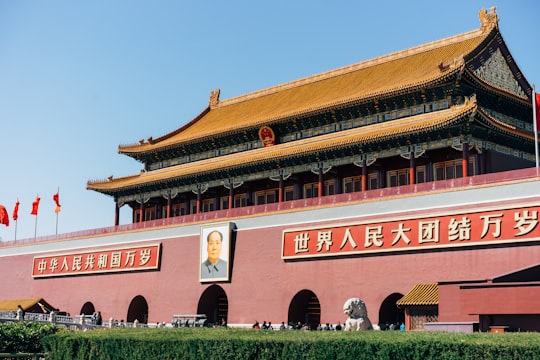 brown and white concrete building in Tiananmen China