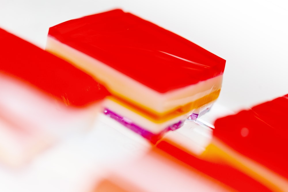 red and yellow cake on white surface