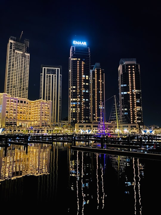 city skyline during night time in Dubai Creek United Arab Emirates