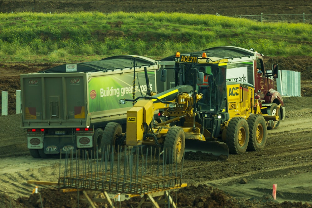 yellow and black heavy equipment on brown soil
