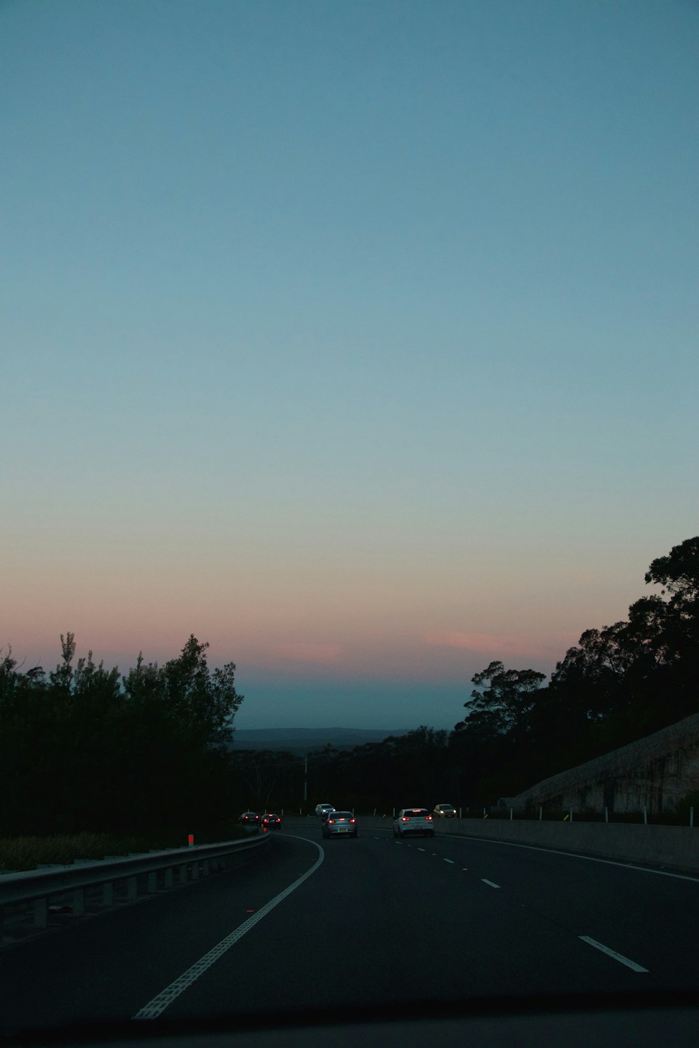 cars on road during sunset