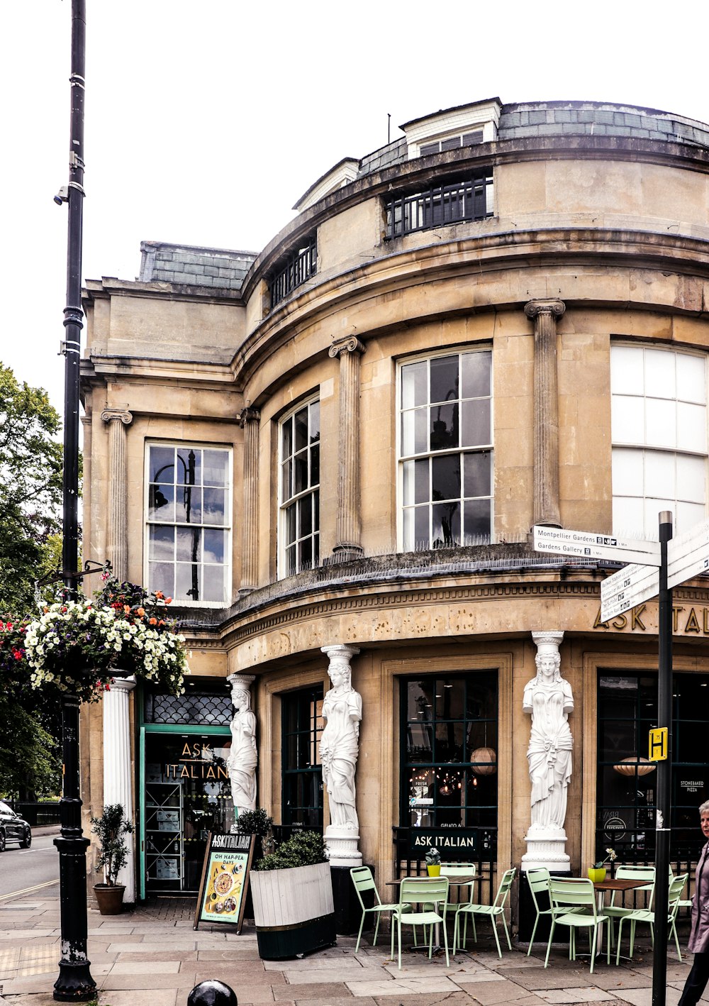 a man walking past a building on a city street