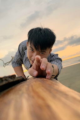 A hopeful volunteer reaching out to people on the street during sunset.