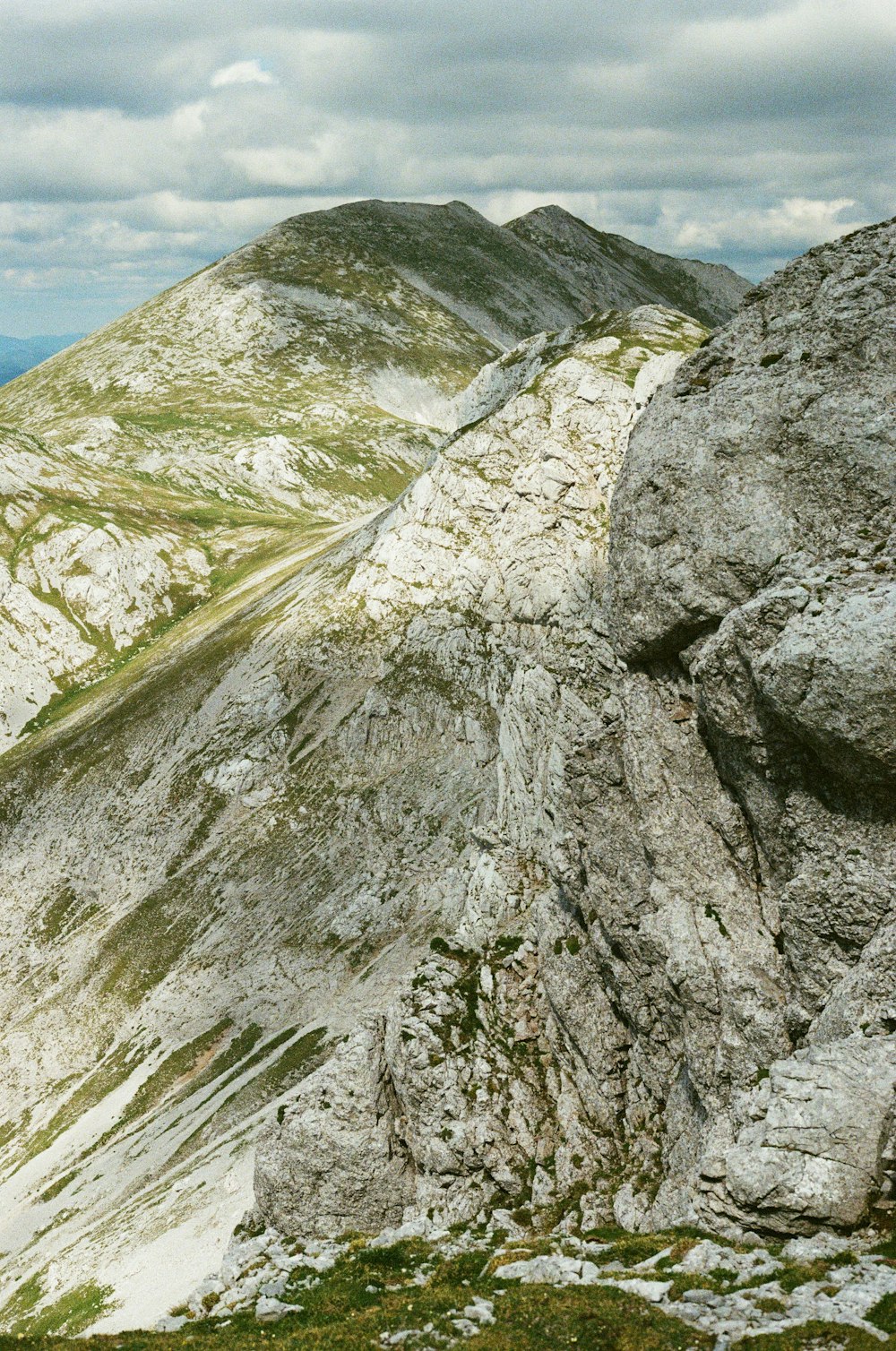 gray and green mountain under blue sky during daytime