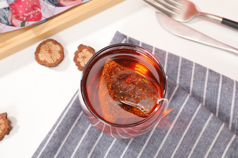 clear glass jar with brown liquid