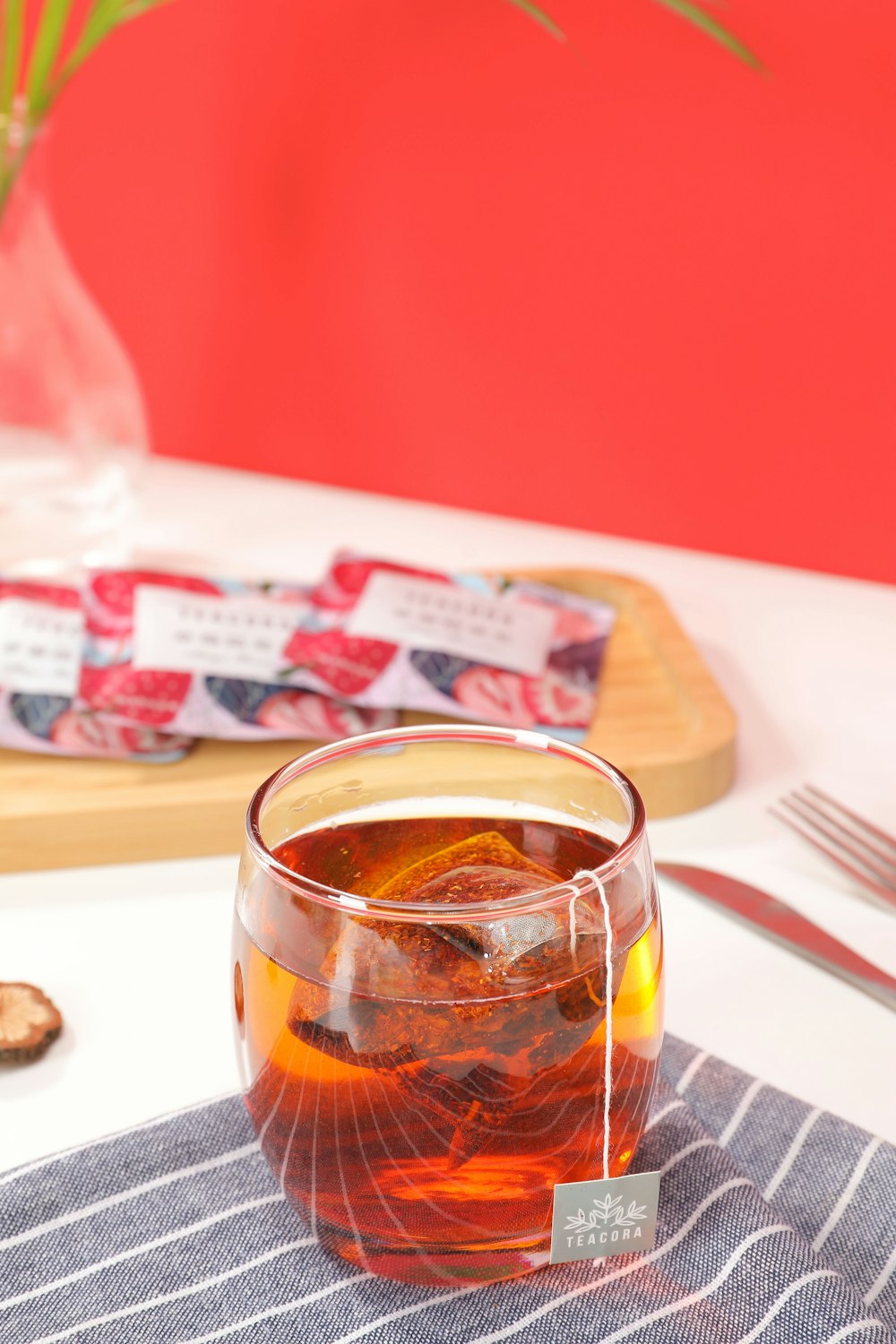 clear drinking glass with brown liquid