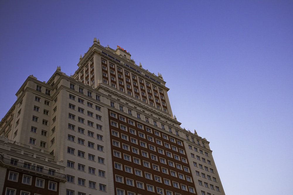 brown concrete building under blue sky during daytime