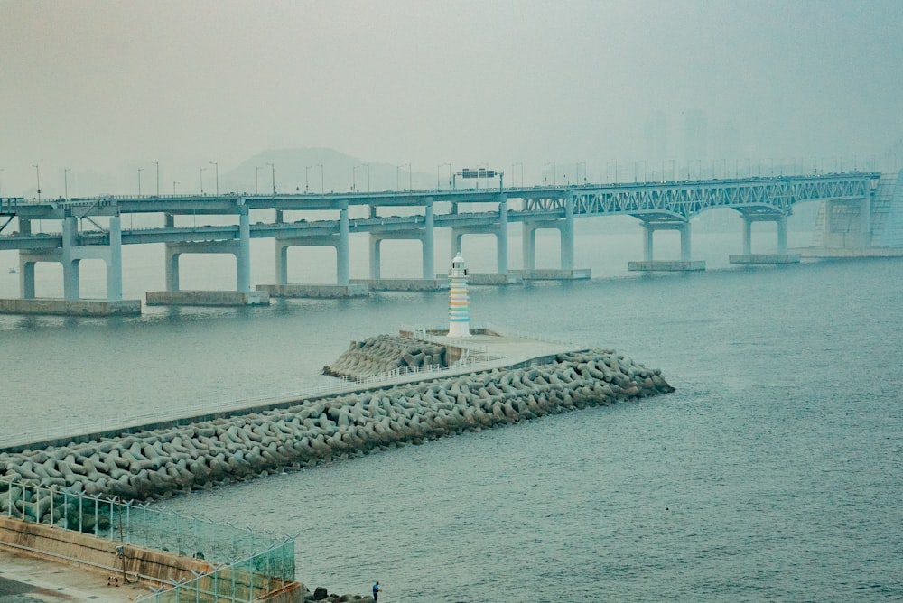 white concrete bridge over river during daytime