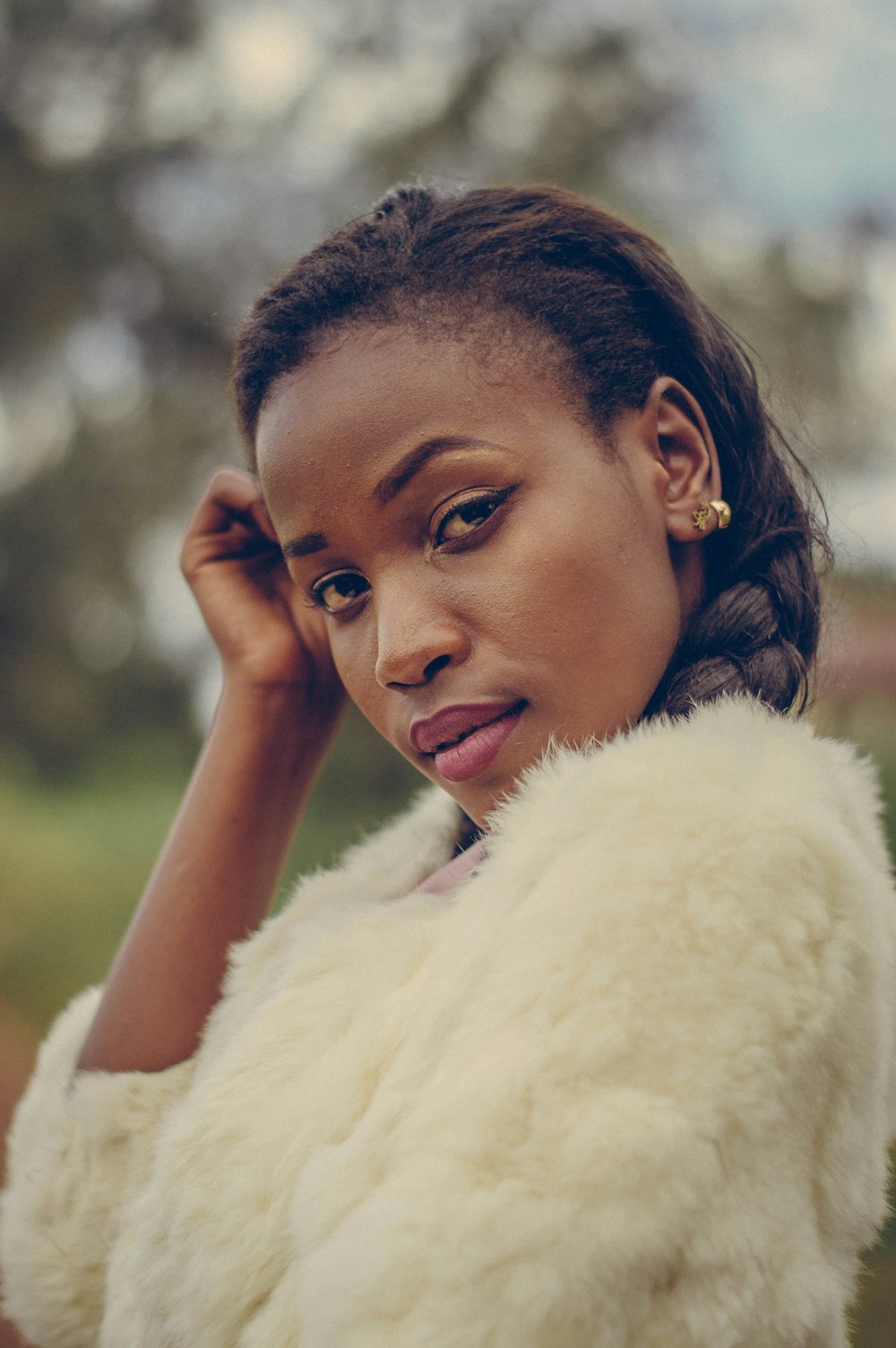 woman in white fur coat