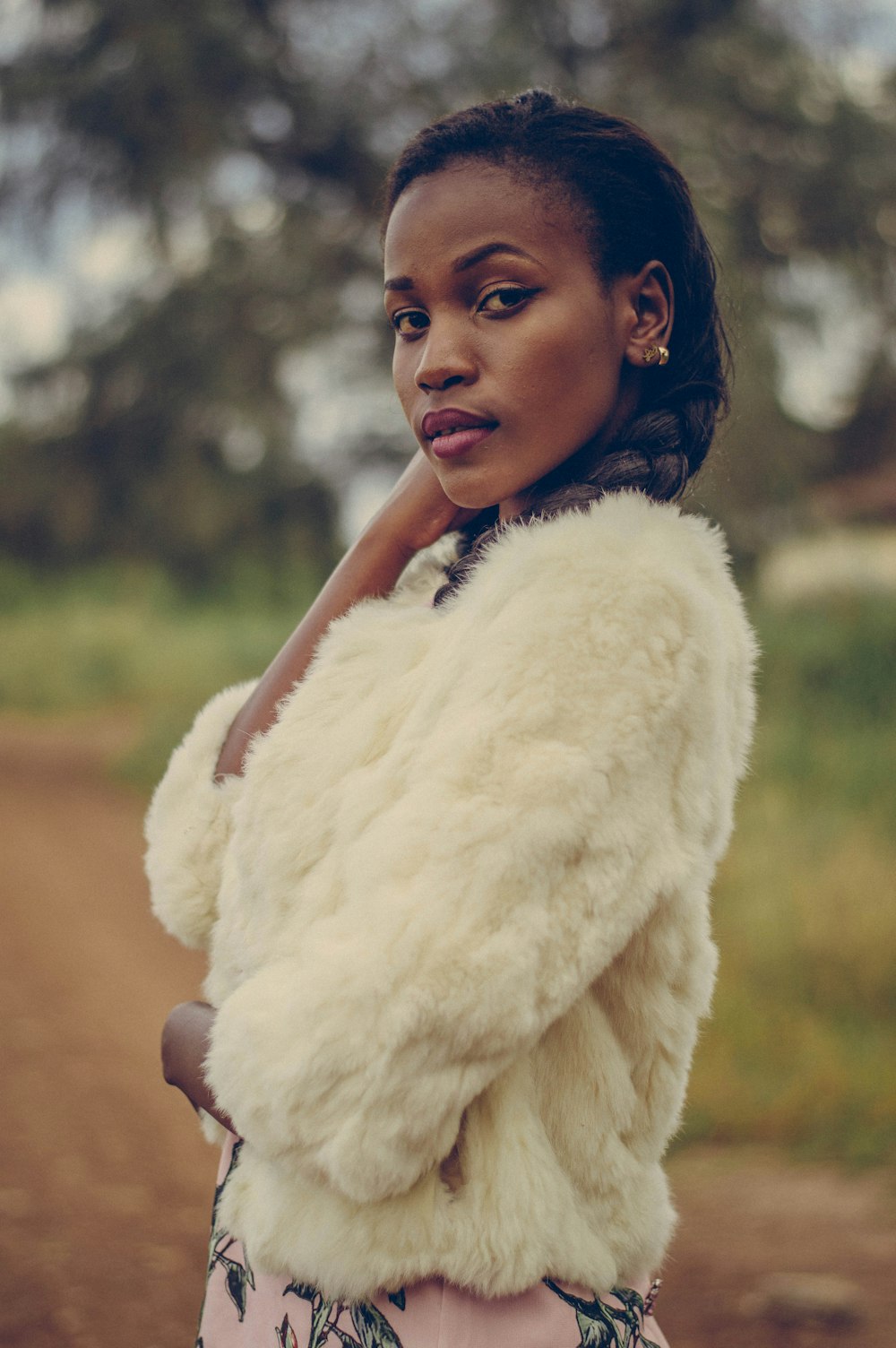 woman in white fur coat