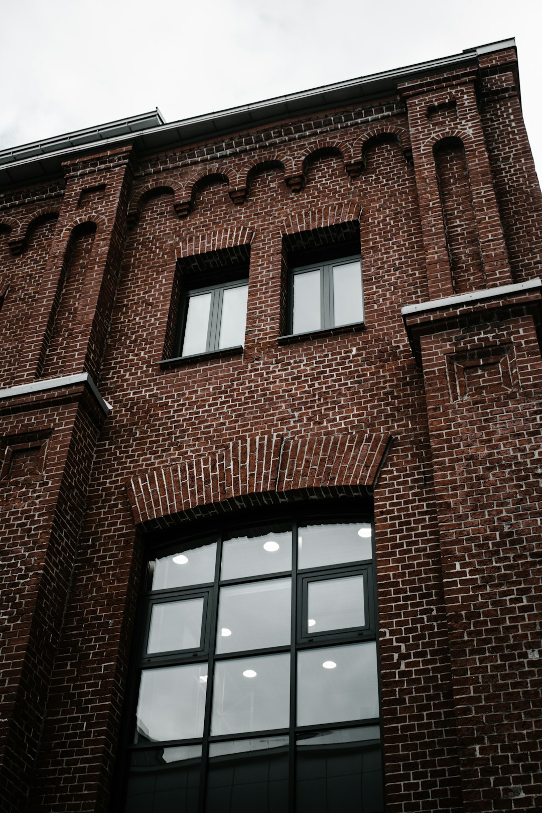 brown brick building with glass windows