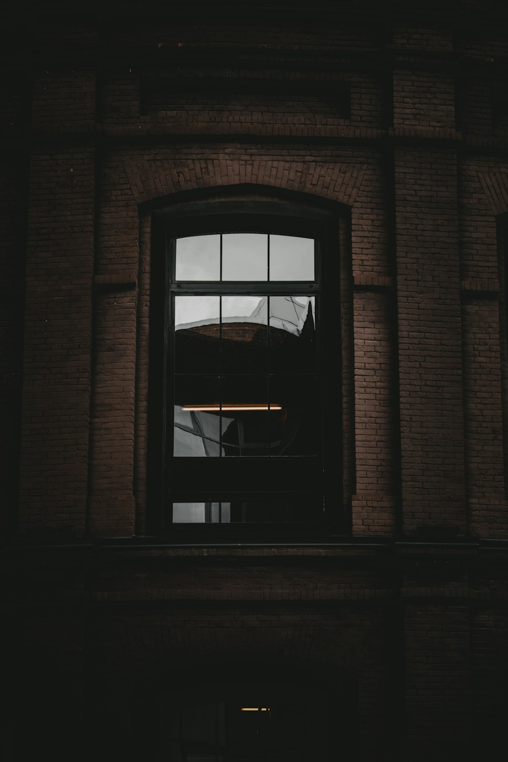 brown wooden framed glass window