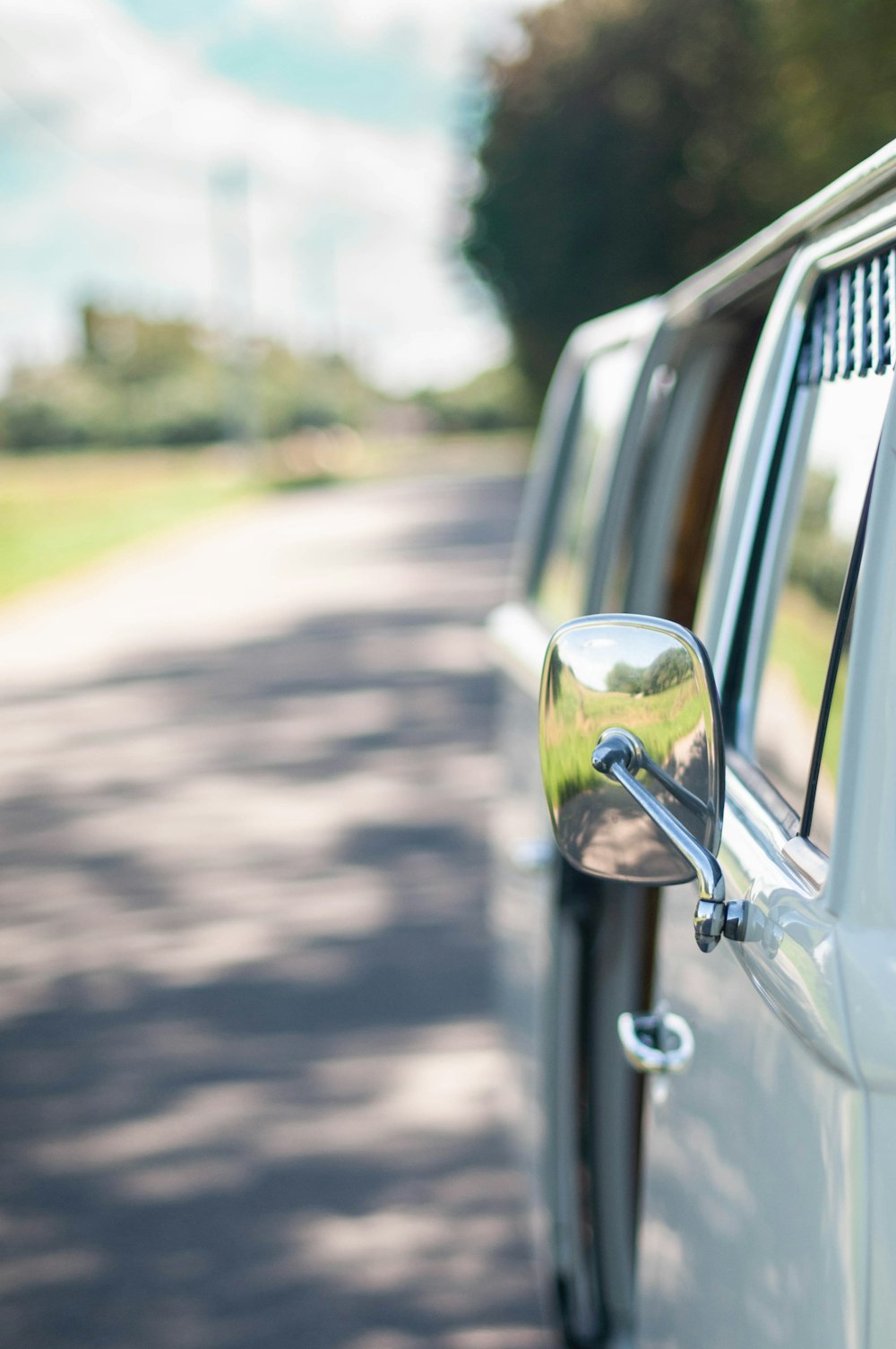 black car side mirror during daytime