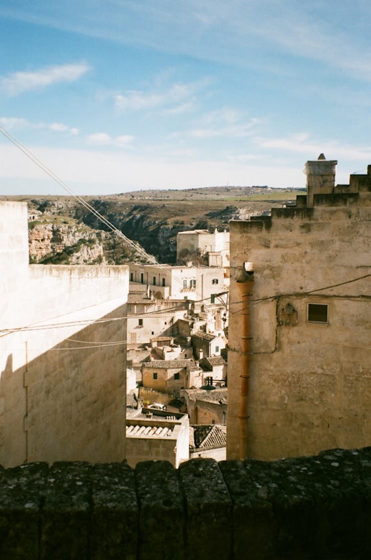 gray concrete building under blue sky during daytime in Matera Italy