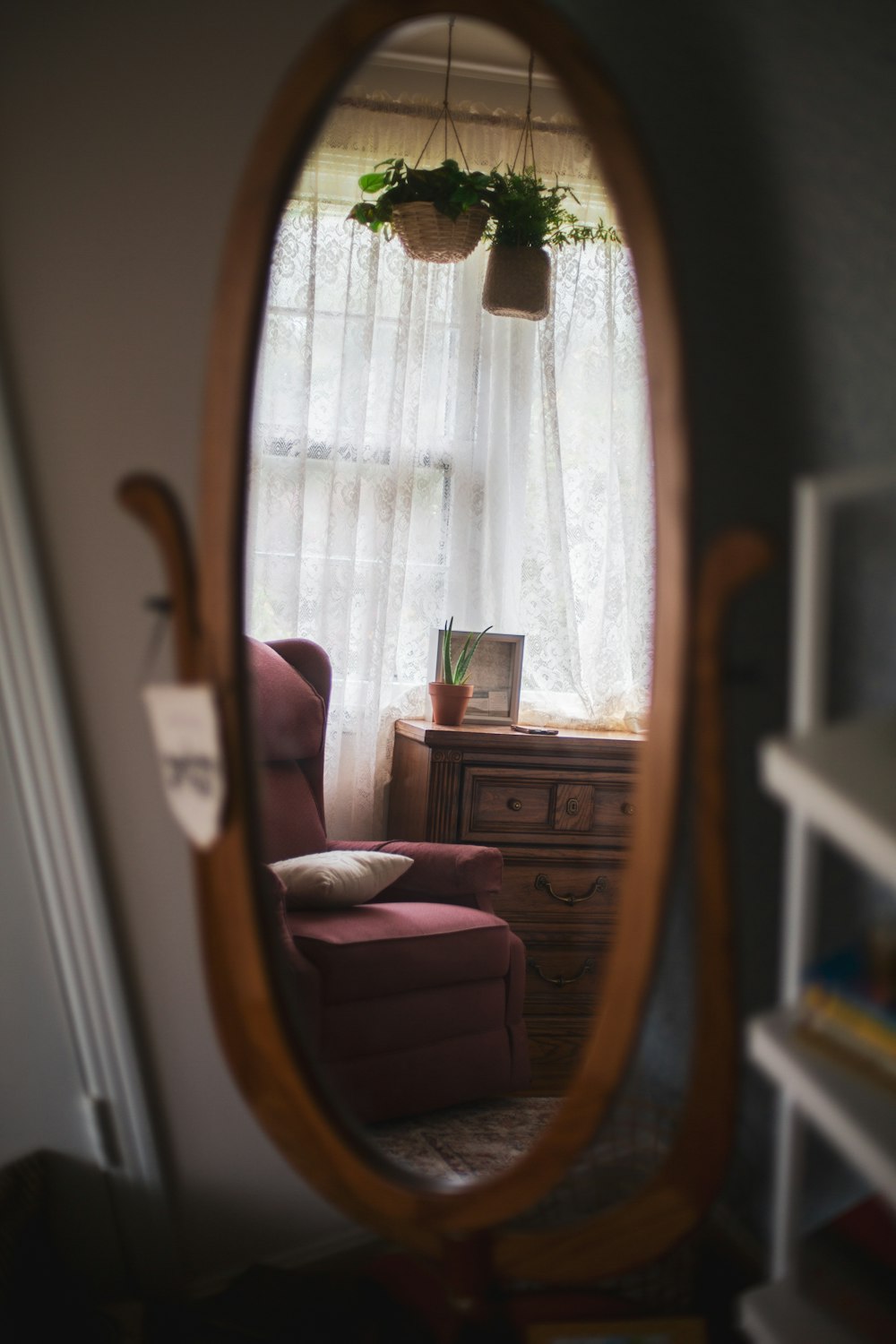 brown wooden framed pink padded armchair