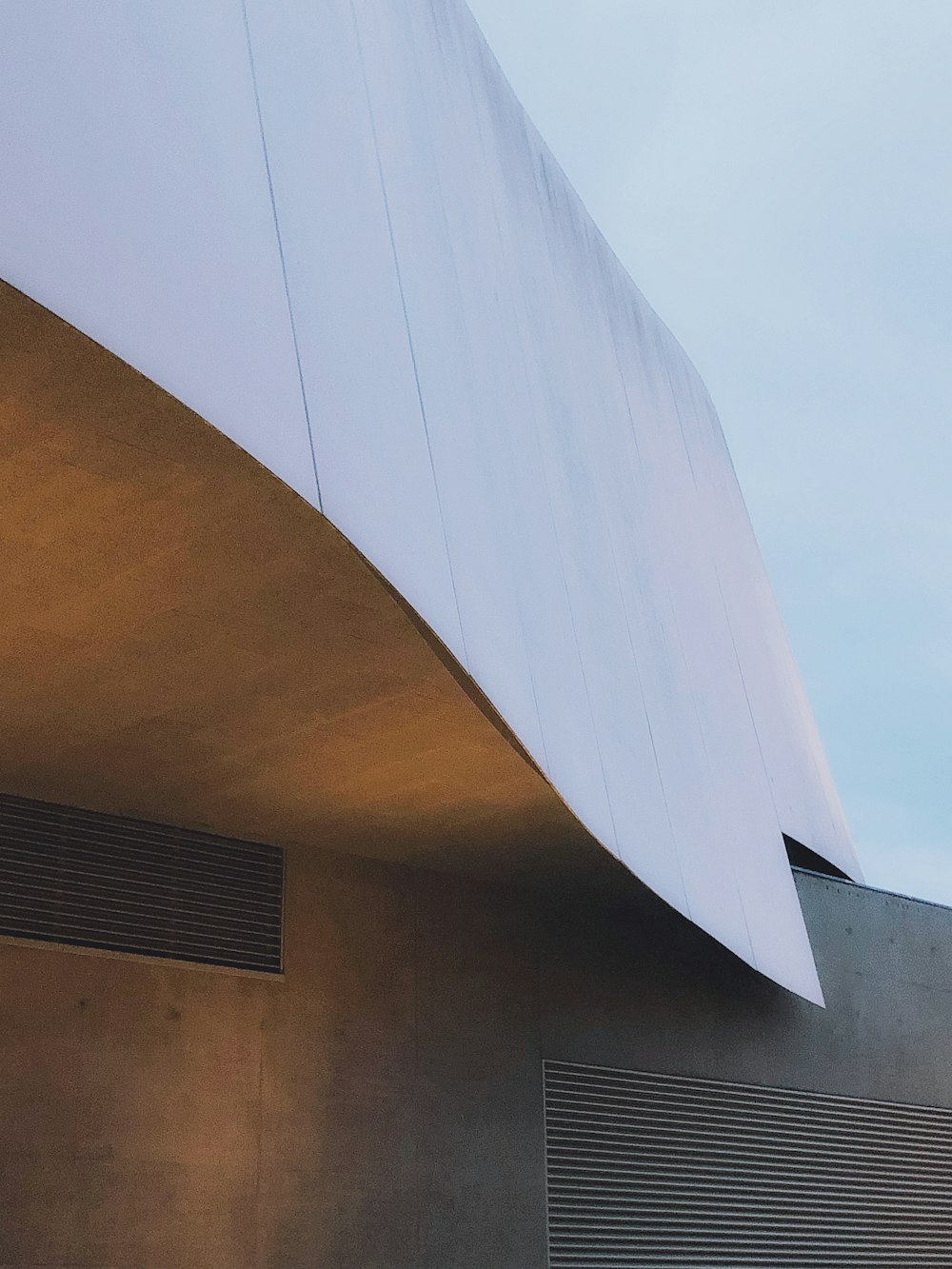 brown concrete building under blue sky during daytime