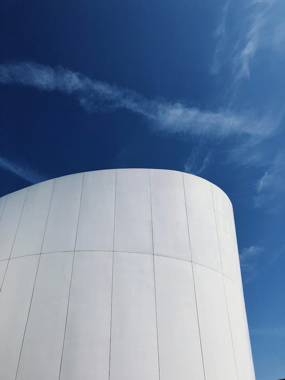 white round building under blue sky during daytime