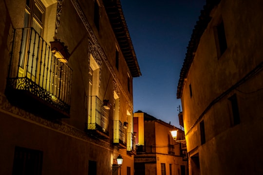 brown concrete building during night time in Chinchón Spain