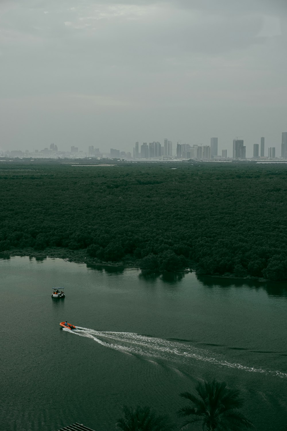 white boat on body of water during daytime