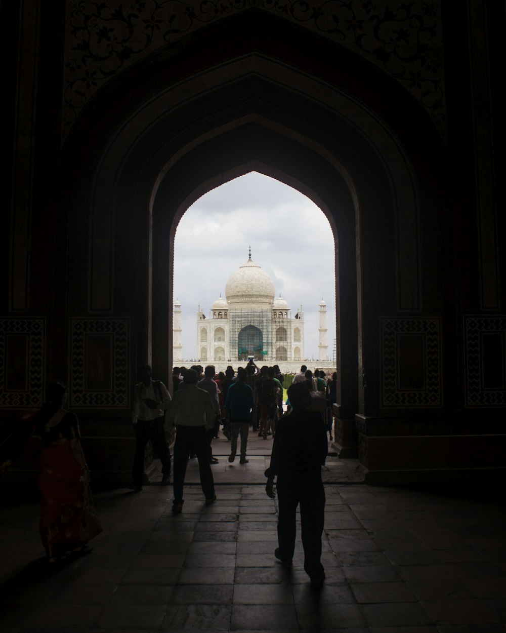 people walking inside dome building