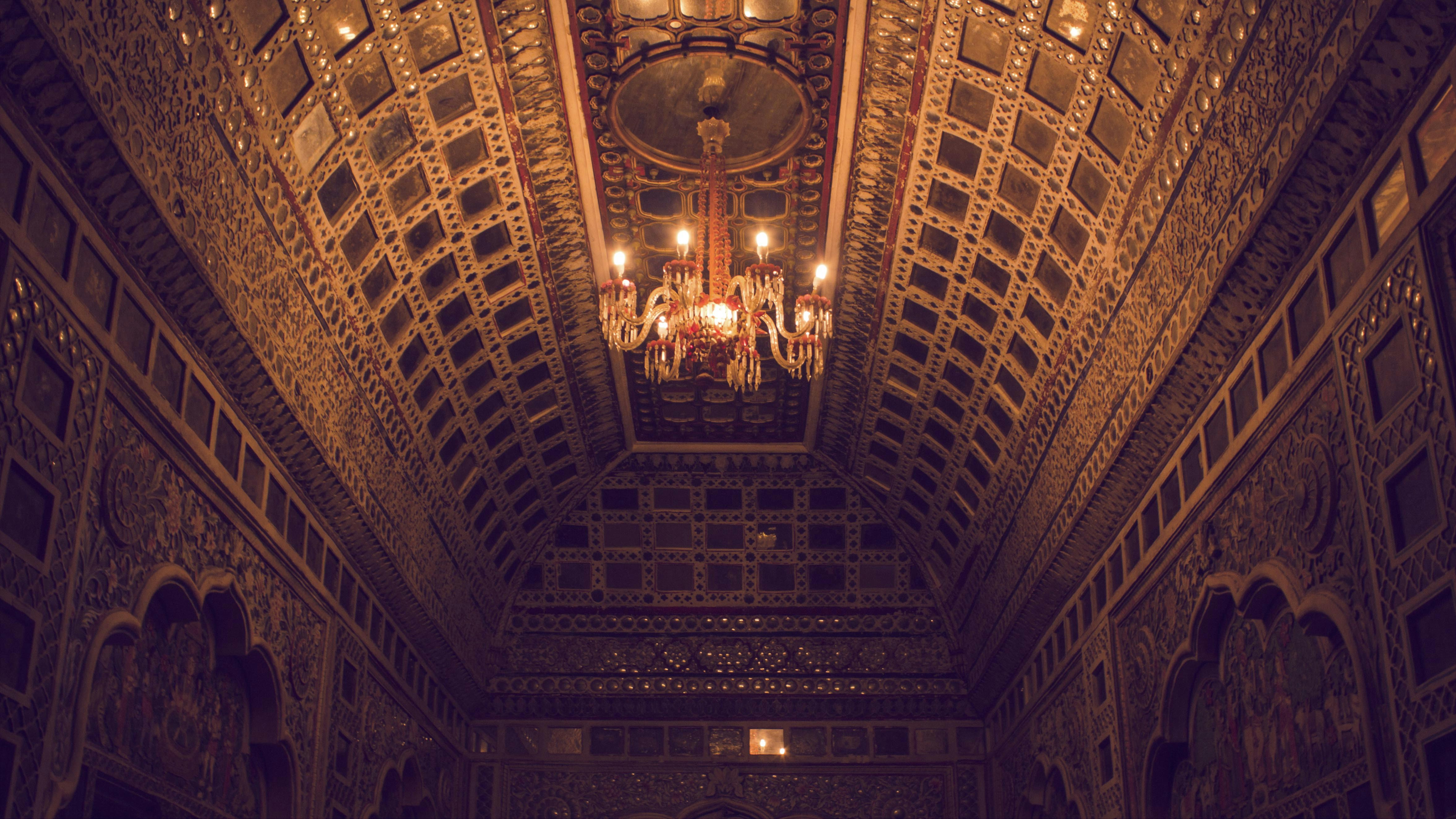 brown and white ceiling with chandeliers