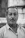 grayscale photo of man in striped shirt