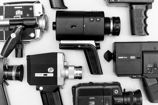 An artistically arranged collection of film cameras.