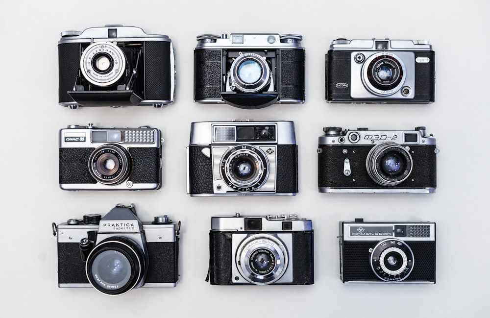 black and silver camera on white table