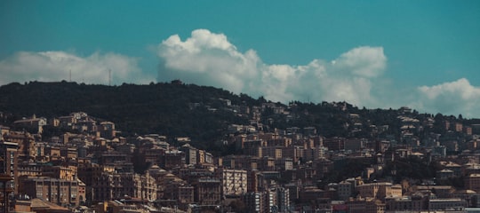 city buildings under blue sky and white clouds during daytime in Genova Italy