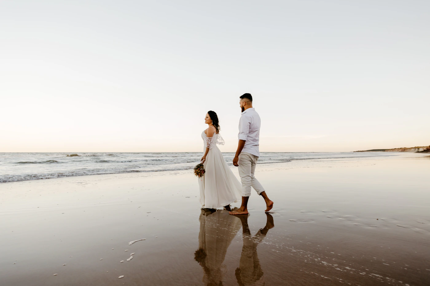 Couple exploring a destination location together naturally on the day after their elopement ceremony