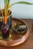 brown wooden chopsticks on clear glass vase