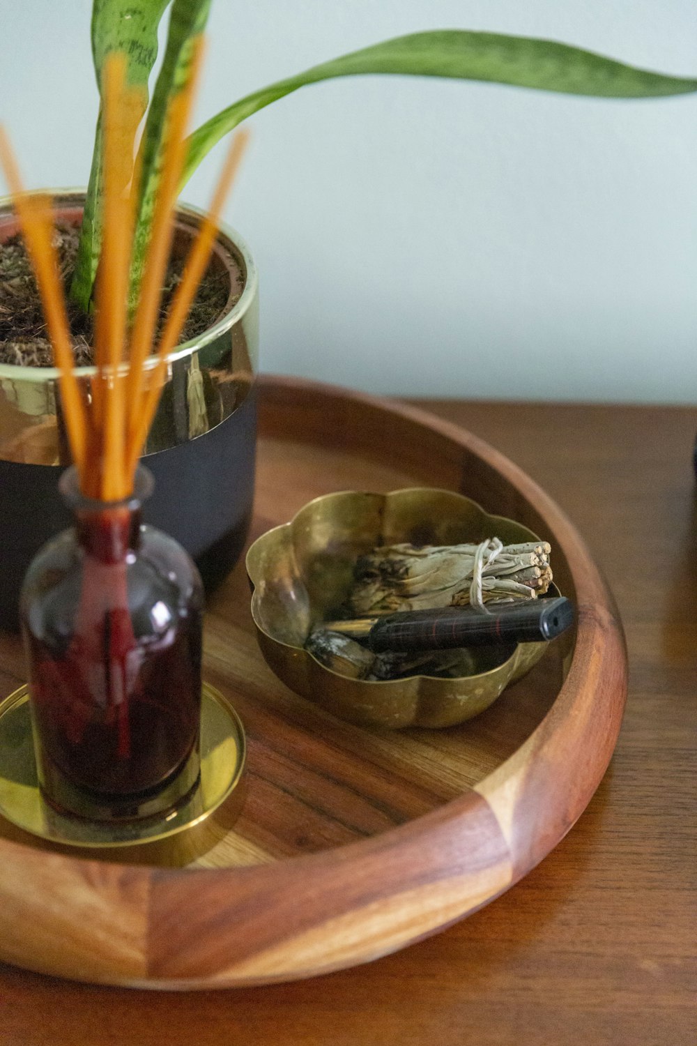 brown wooden chopsticks on clear glass vase