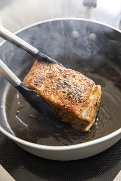fish on black ceramic plate