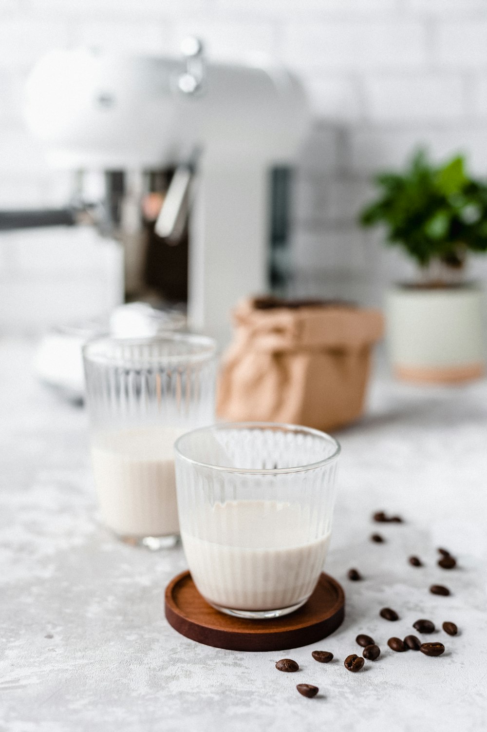 white liquid in clear drinking glass