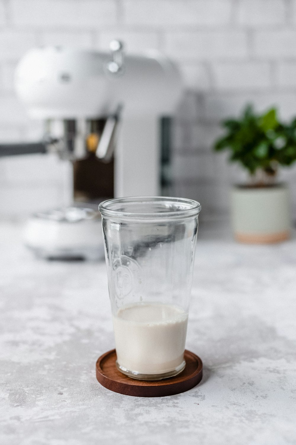 clear drinking glass with white liquid